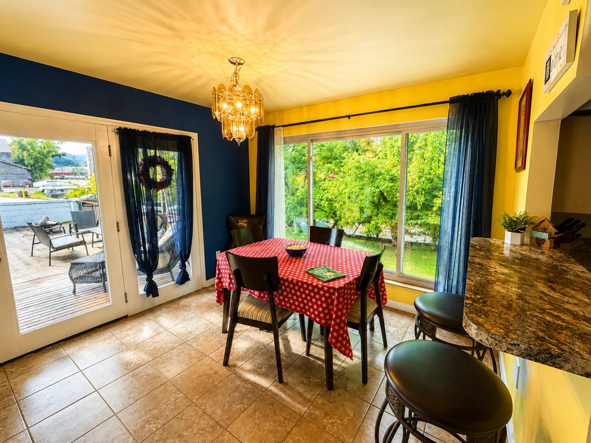 Dining room with large windows looking out at the river